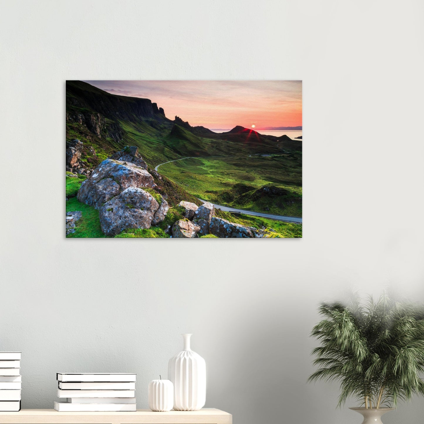 Canvas print of The Quiraing on the Isle of Skye at sunset with vibrant pink and orange sky over rugged cliffs and winding road.