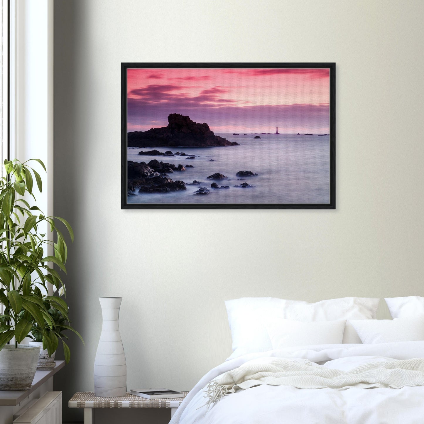 Framed wall art of lighthouse with pastel skies and coastal rocks