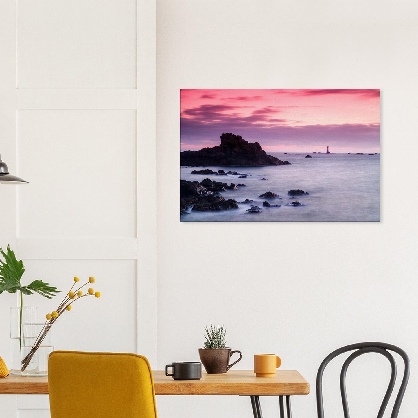 Canvas print of Les Hanois Lighthouse framed by the soft tones of a fading sky and the gentle textures of coastal rocks.
