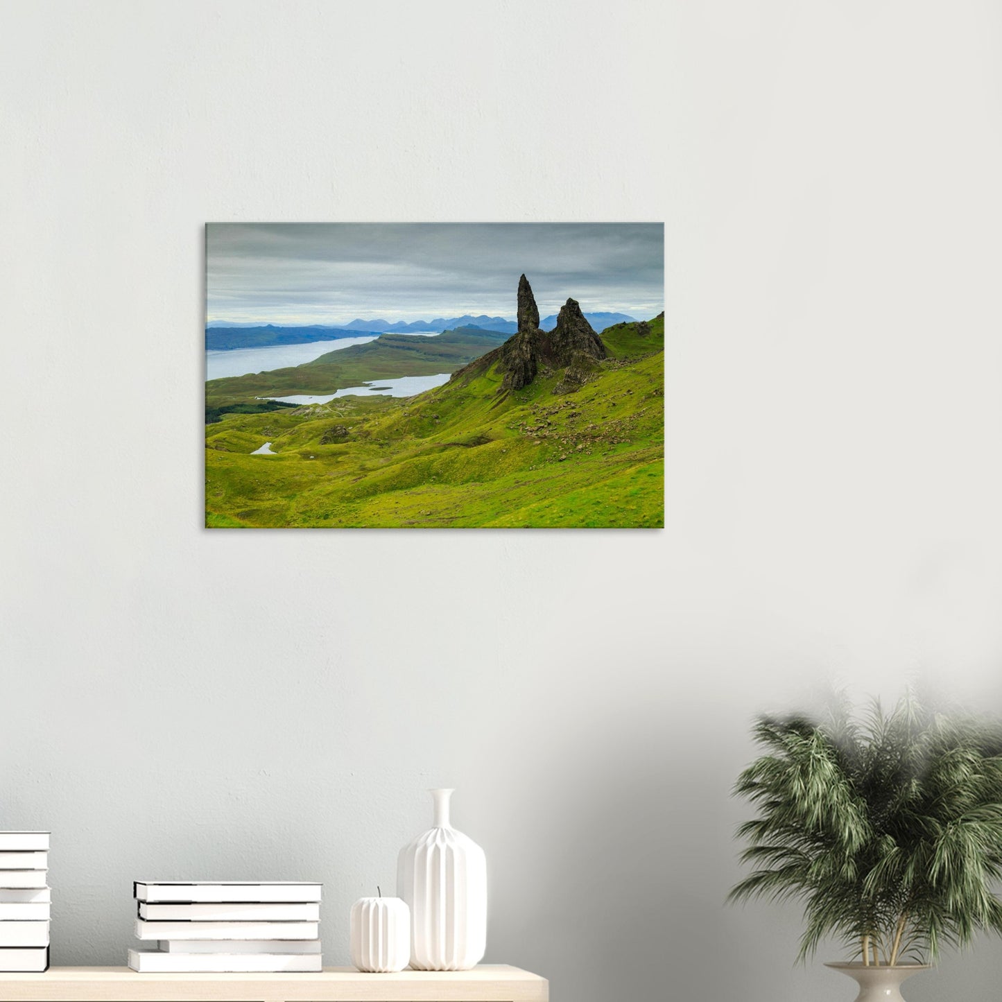 Dramatic Skye canvas showing The Old Man of Storr standing above a patchwork of greenery and reflective lochs.