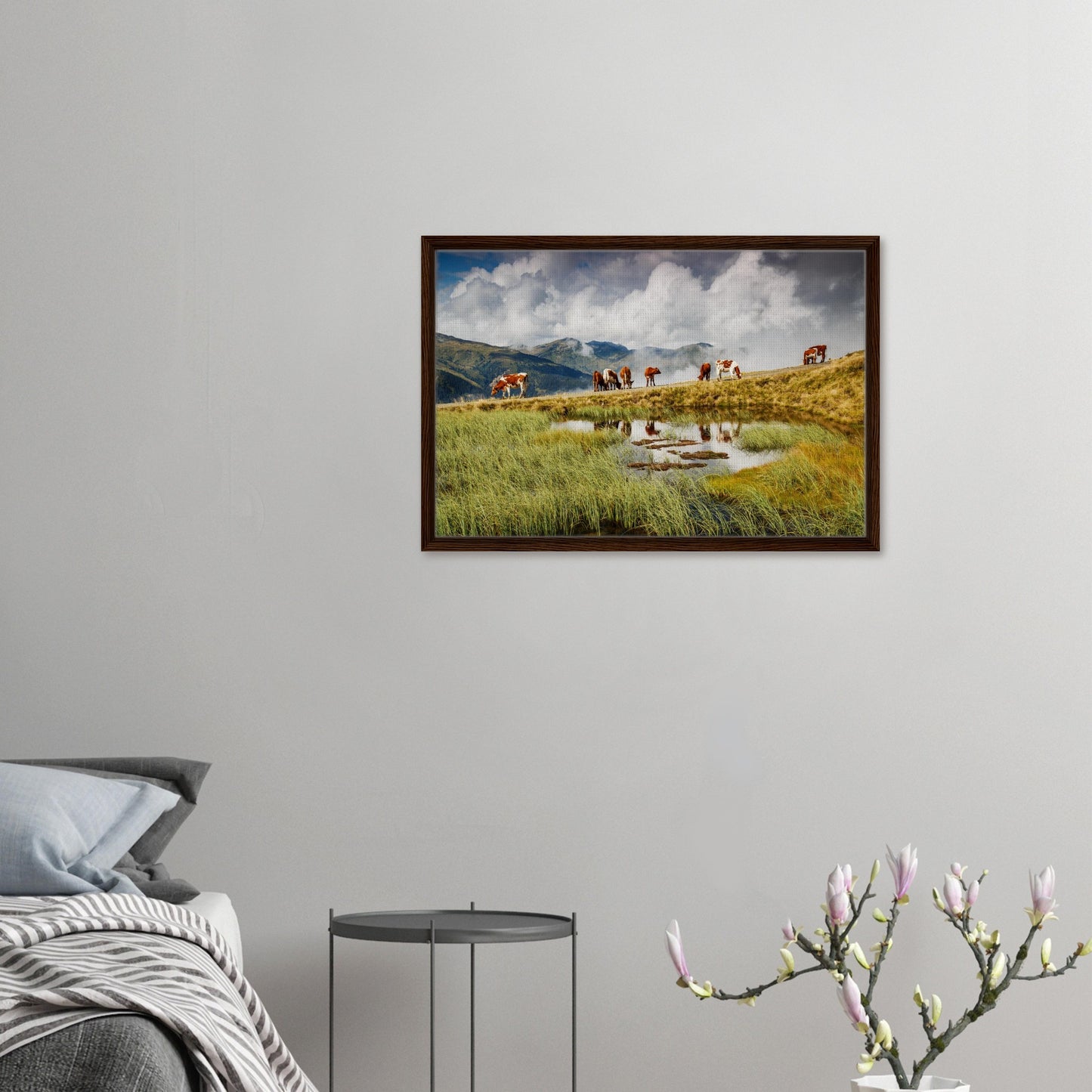 Framed print of lush meadow with cows and mountain backdrop