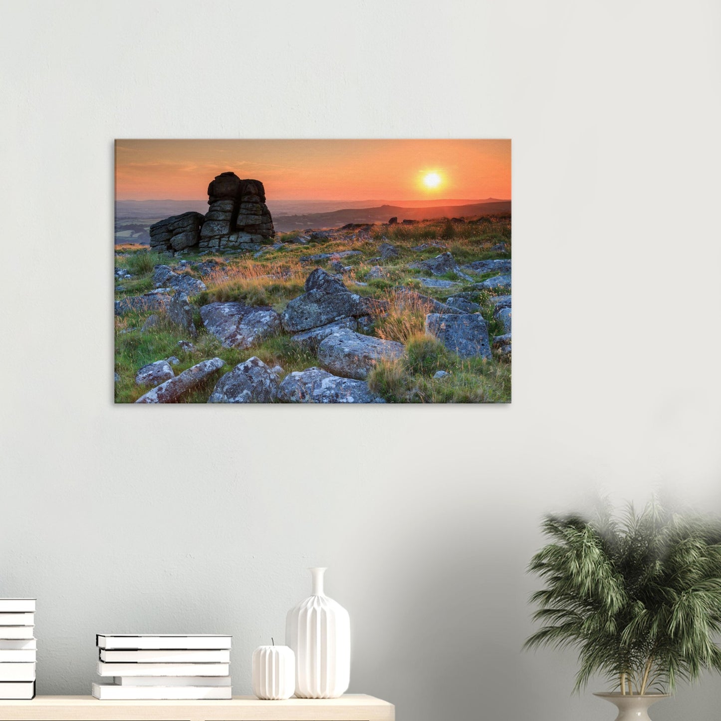 Timeless landscape of Leeden Tor surrounded by moorland grasses glowing in evening sunlight