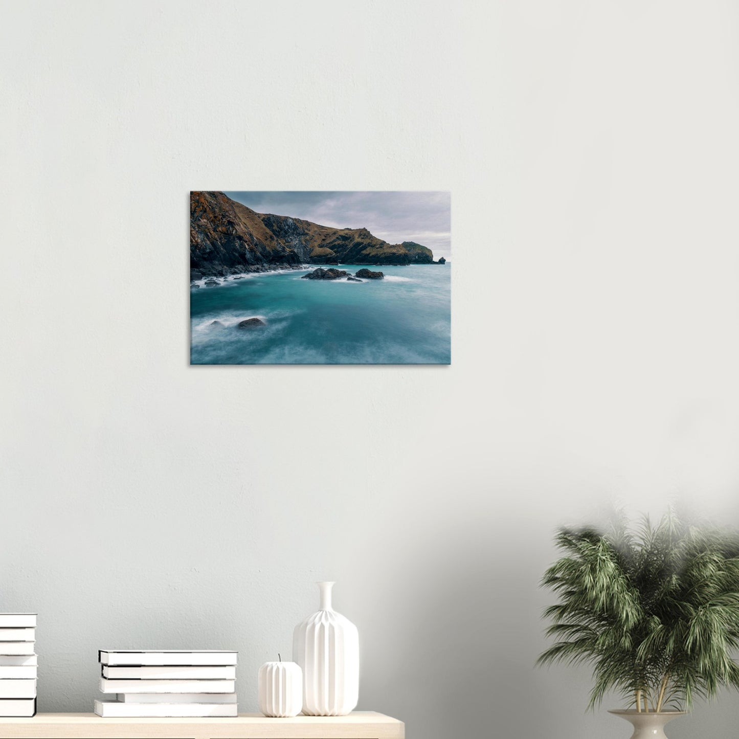 Turquoise water flowing around dark rocks in Mullion Cove wall print