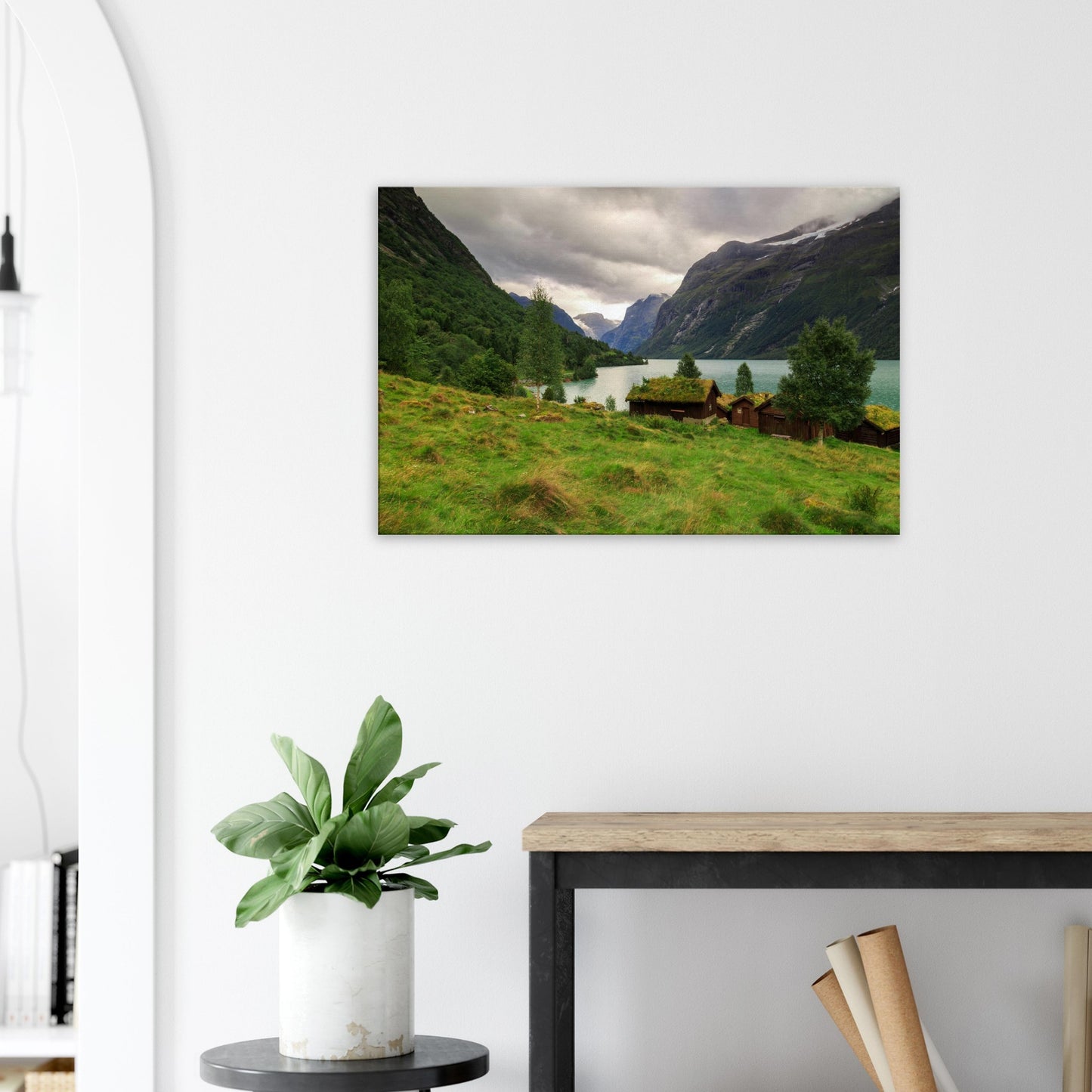 Vibrant canvas print capturing the raw beauty of Lodalen Valley with tranquil waters, traditional houses, and steep mountain walls.