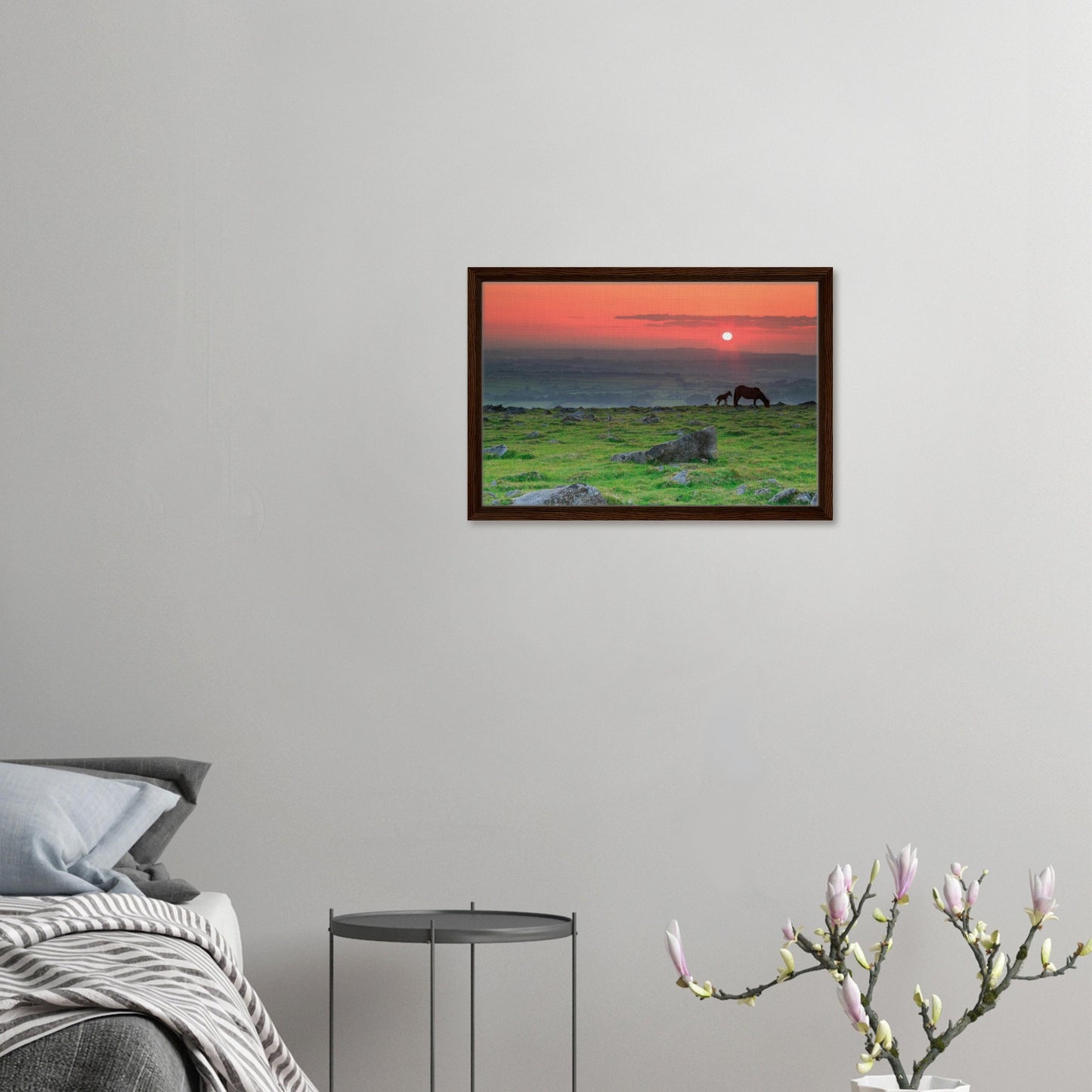 Silhouette of mare and foal in red sunset on Dartmoor moorland