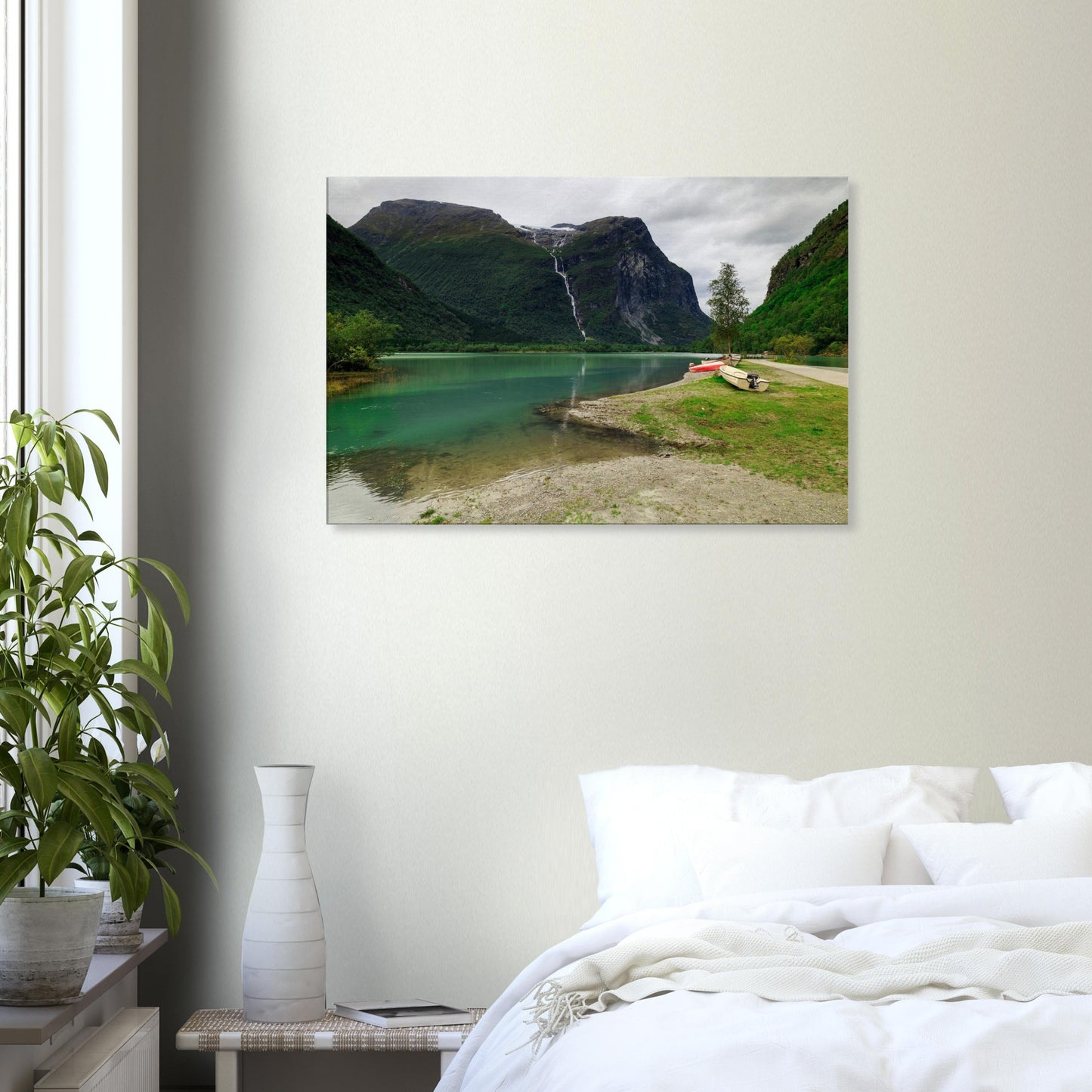 Tranquil Norwegian mountain scene featuring emerald waters, boats, and a striking waterfall feature