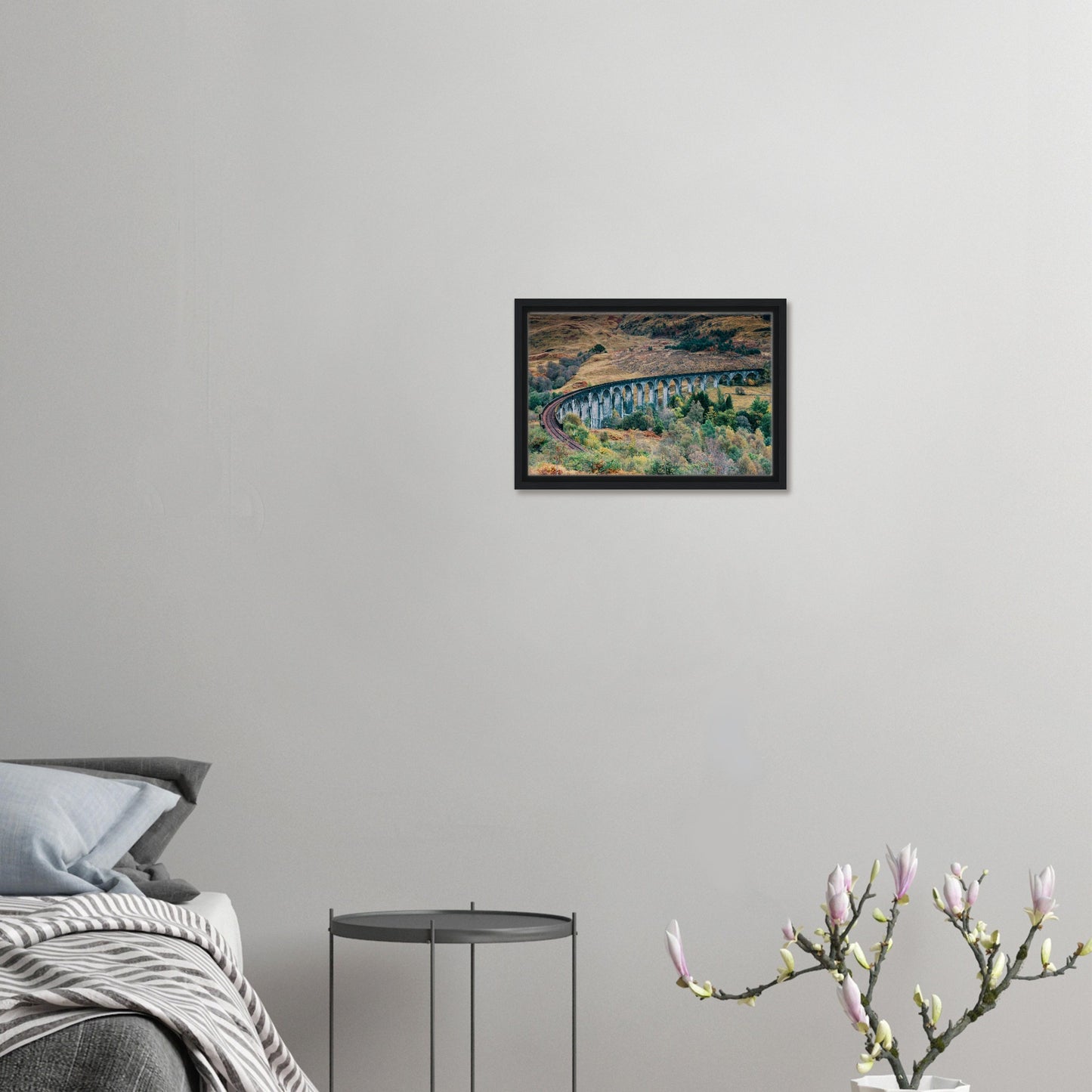 Curved stone viaduct among fall trees canvas