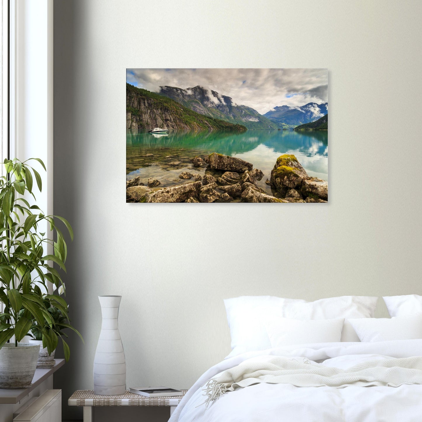 Peaceful Nordic wilderness scene featuring calm waters, a solitary boat, and misty rocky cliffs