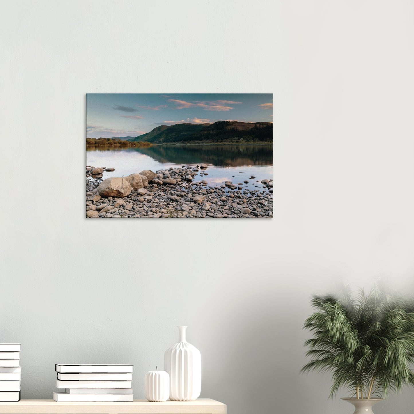 Peaceful lakeside moment in Cumbria with pastel colours and mirrored sky