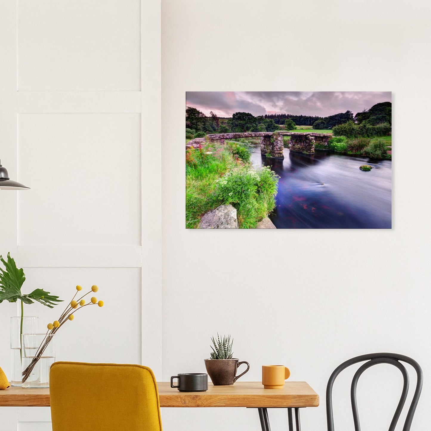 Tranquil Dartmoor river and stone bridge in summer bloom