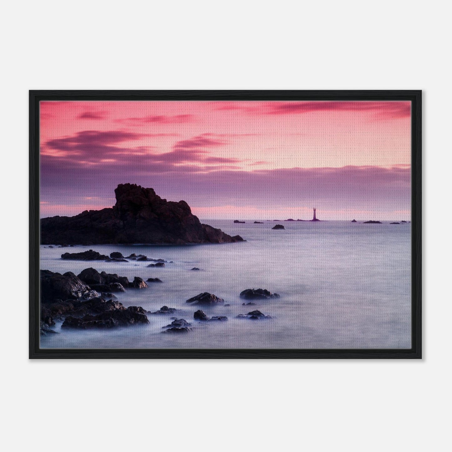 Silhouette of Les Hanois Lighthouse under pink and purple sky