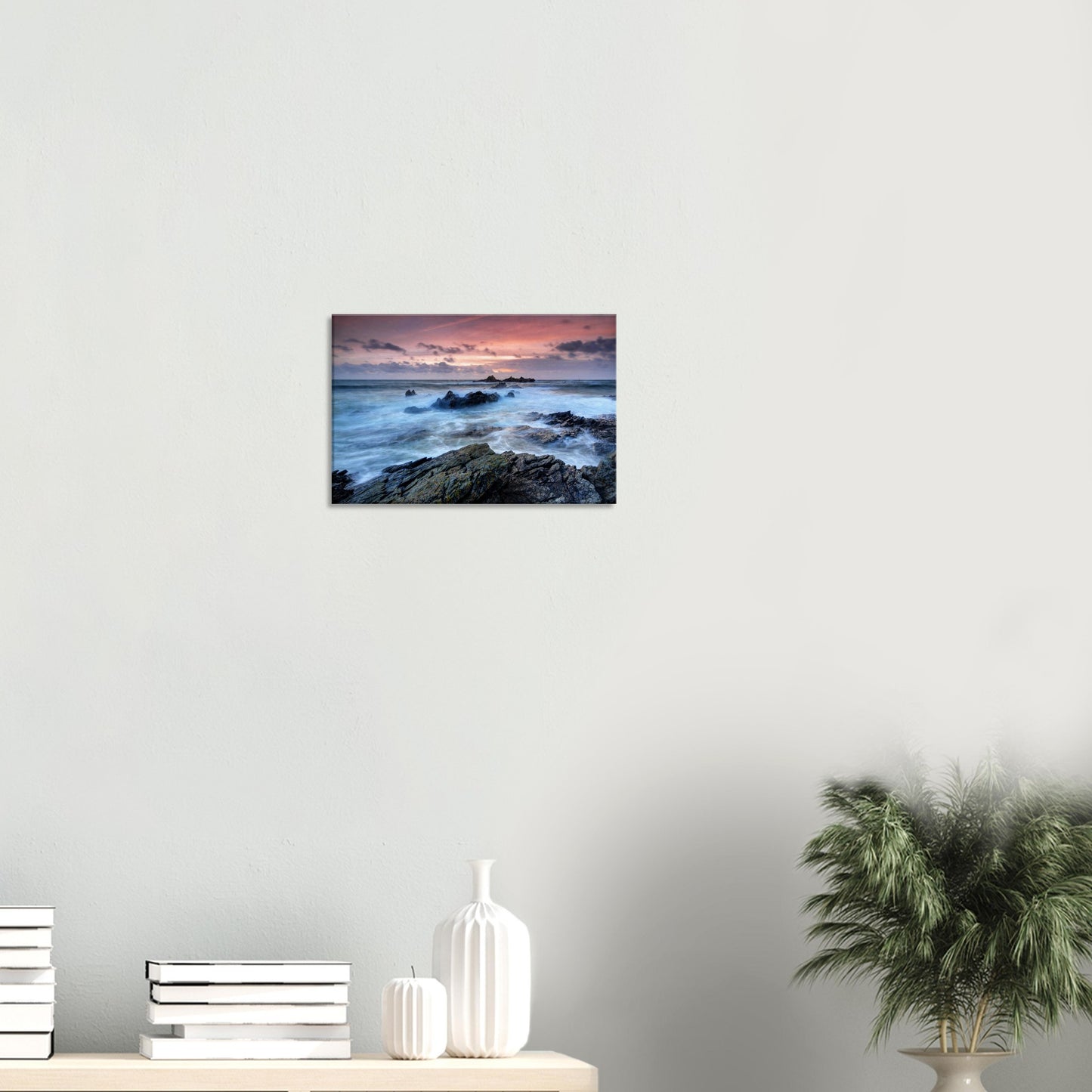 Canvas artwork of Heybrook Bay at dusk with motion-blurred waves frothing near rocks under a glowing red and orange sky.
