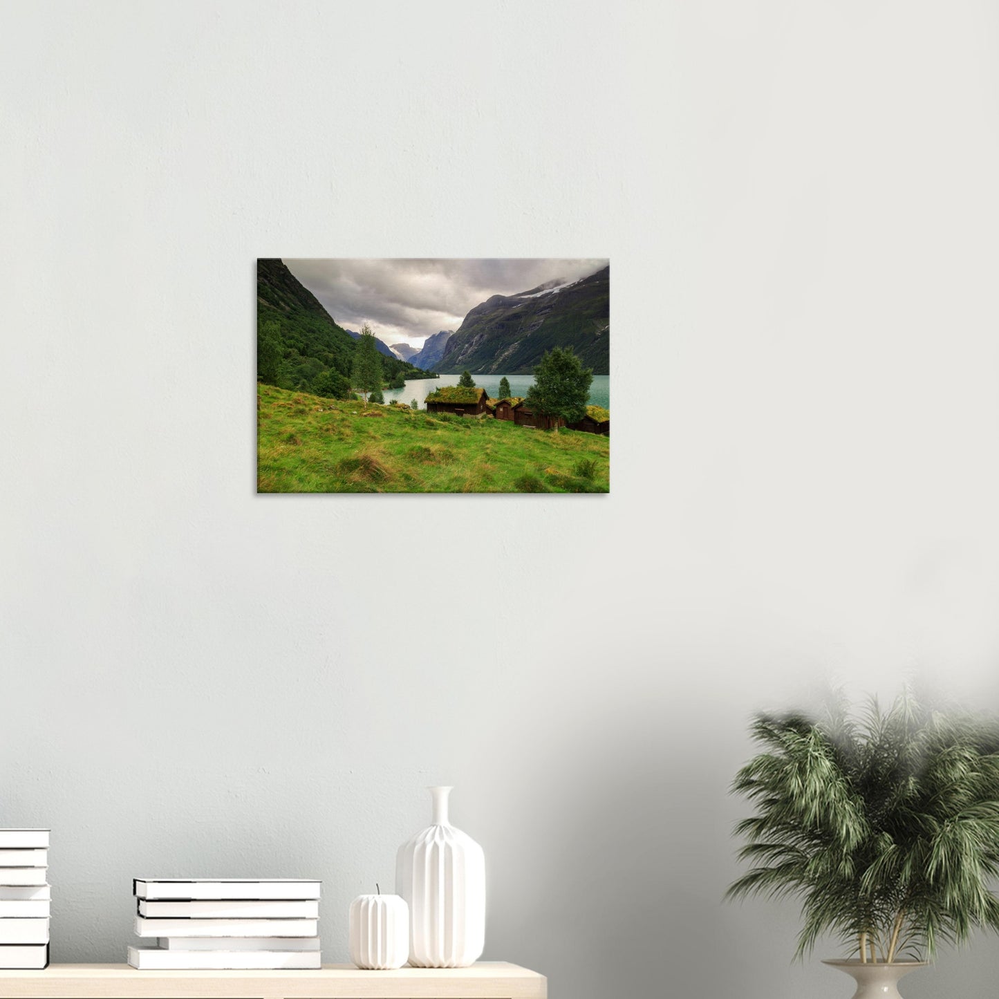 Enchanting Norwegian valley captured on canvas with turquoise lake, wooden cabins with grass roofs, and majestic mountain cliffs.