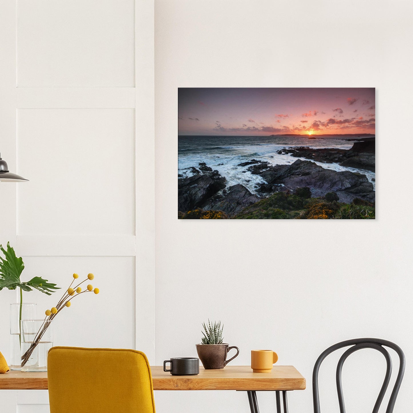Canvas print capturing Heybrook Bay’s sunset glow with silhouetted rocky coastline, glowing waters, and wildflowers in the coastal breeze.