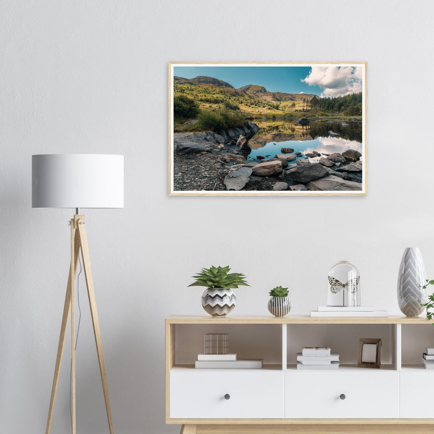 Still waters of Llyn Llywelyn reflecting sky framed print