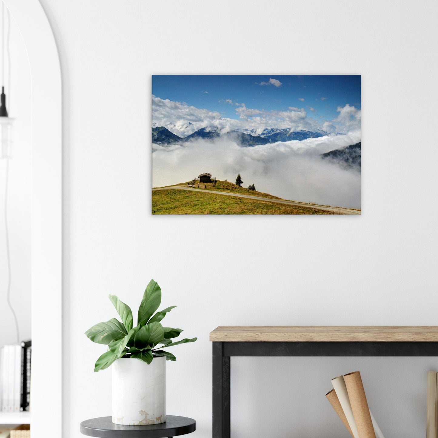 Resterhöhe canvas print with a panoramic alpine view, green hilltop, low-hanging clouds, and soaring peaks under a bright blue sky.