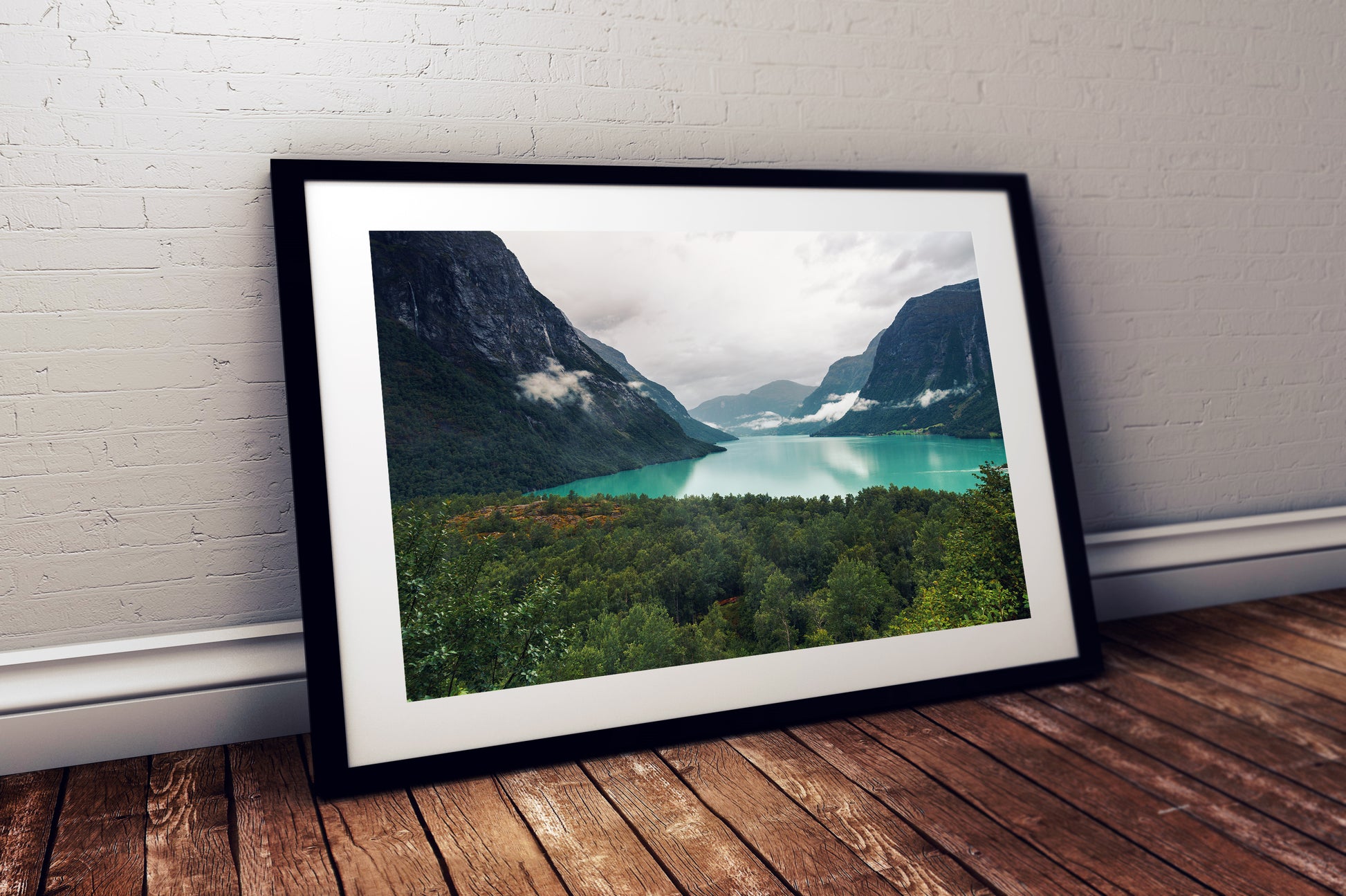 High-resolution photograph of Lovatnet Lake with misty cliffs