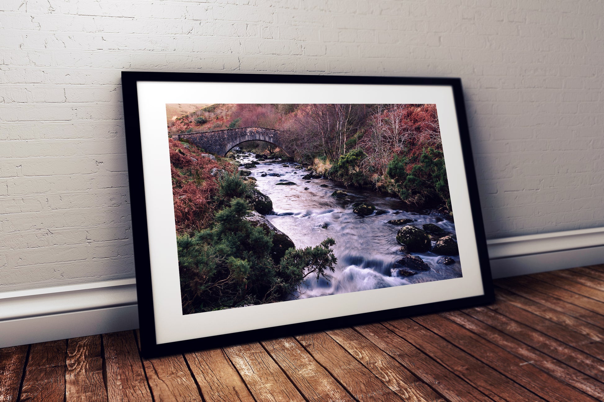 Flowing river with mossy rocks West Okement Dartmoor