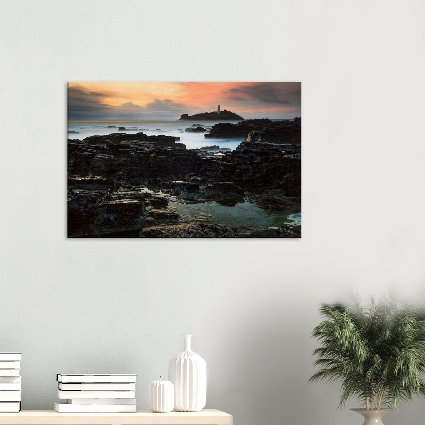 Golden hour at Godrevy Lighthouse captured on canvas, with warm tones and rock textures.