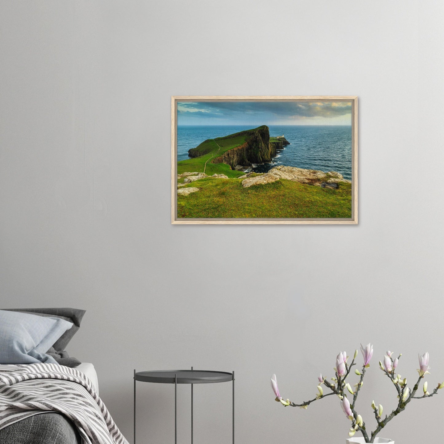 Lighthouse perched on Neist Point in moody sunset light