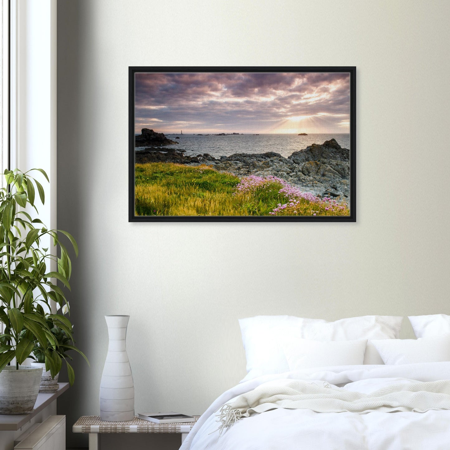 Guernsey framed canvas with radiant sky, rocks, and lighthouse