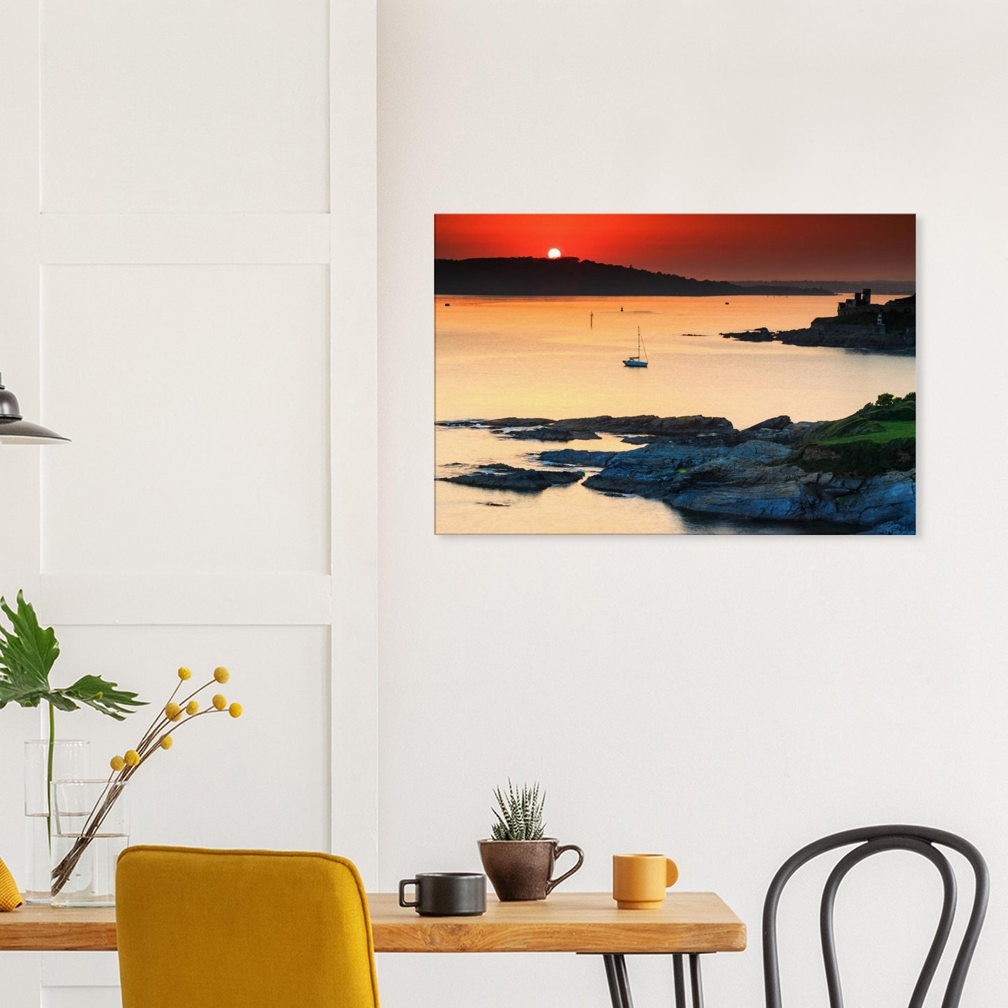 Sunset over Plymouth Sound canvas print, showing layered rocks and distant sea walls.