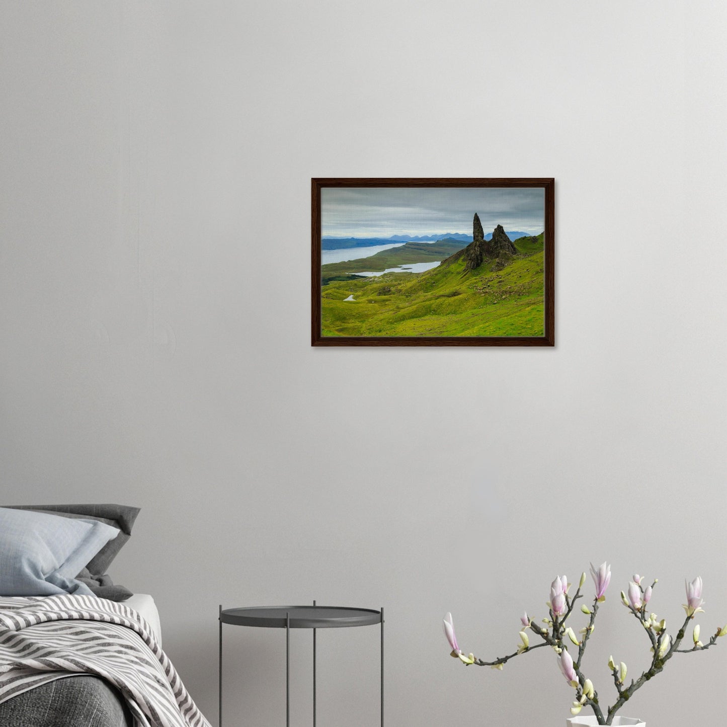 Verdant hills and rocky cliffs under moody skies in framed print
