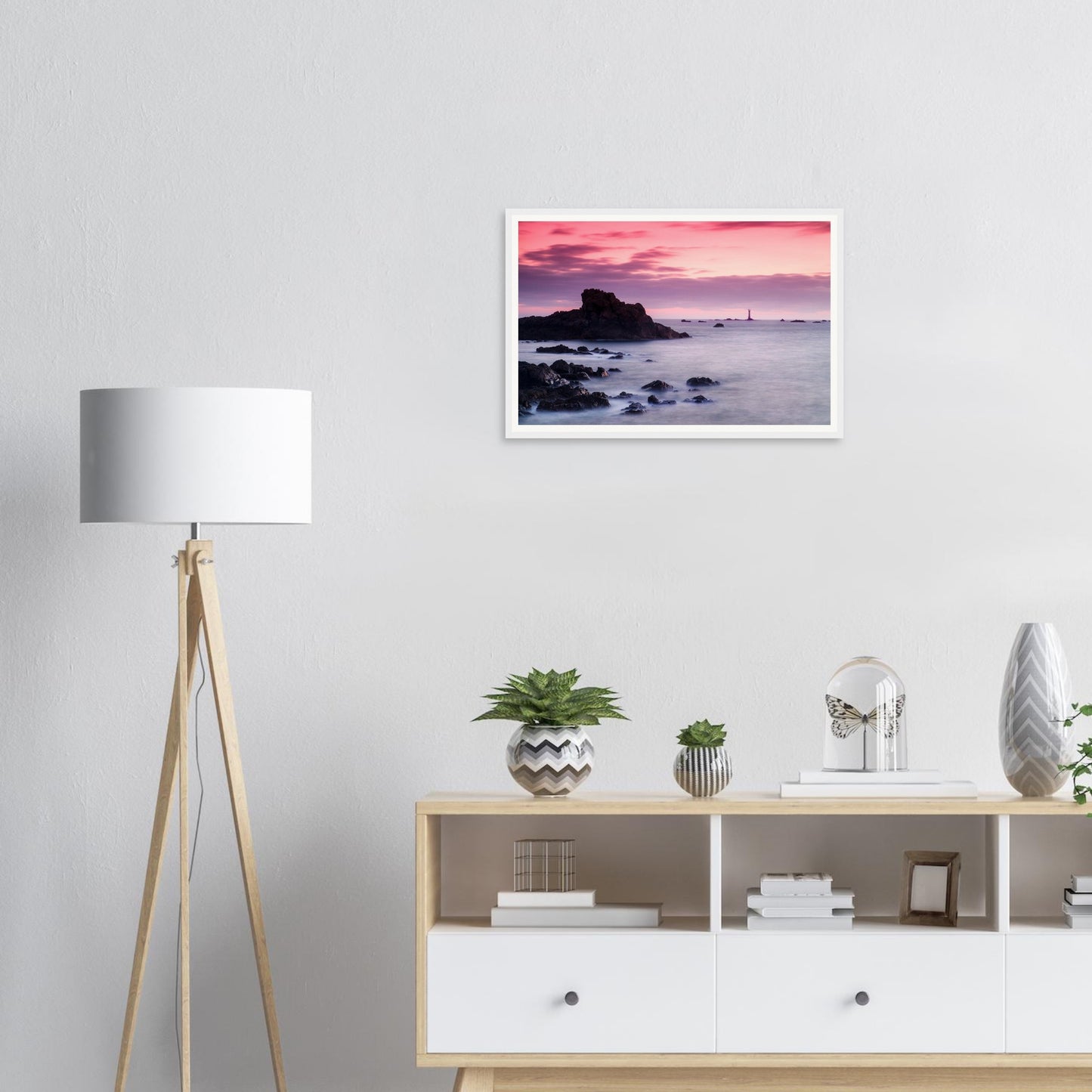 Tranquil sea at dusk with Les Hanois Lighthouse framed print