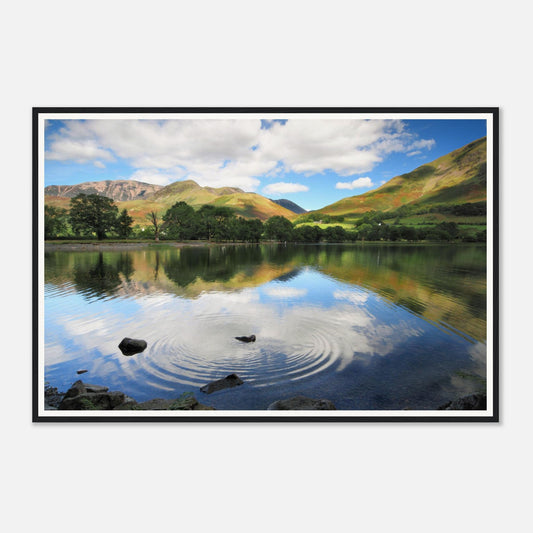 Stone skipping across Buttermere Lake framed wall art