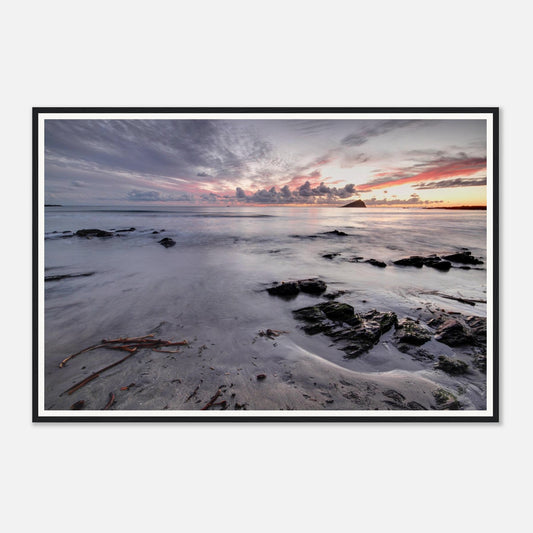 The Mewstone silhouetted on the horizon at Wembury Beach