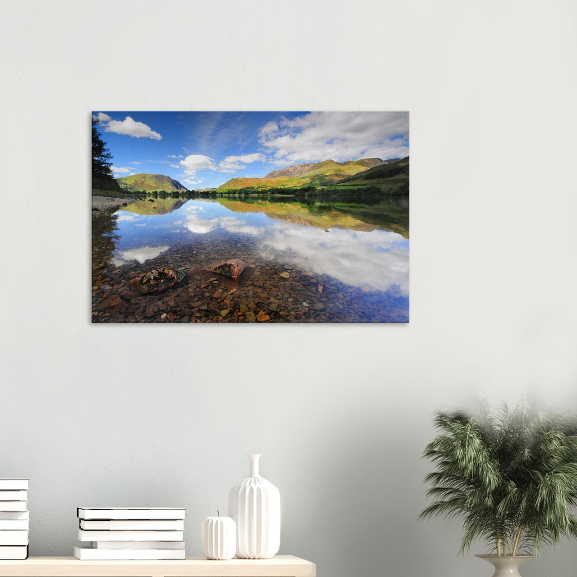 Tranquil canvas artwork of Buttermere Lake featuring transparent water, reflected hills and sky, and light playing gently across the peaceful landscape.