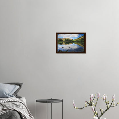 Buttermere framed landscape with water ripples and soft sky