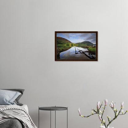 Framed canvas with quiet waters and sculptural foreground branch