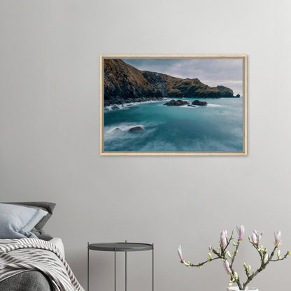 Rugged cliffs and calm sea framed canvas