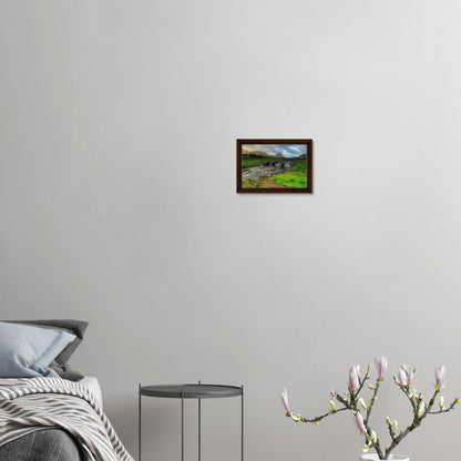 Canvas print of Sligachan Bridge under cloudy mountain sky