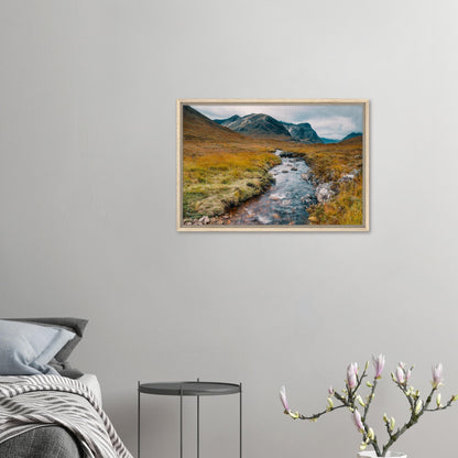 Highland valley with cloudy mountain peaks