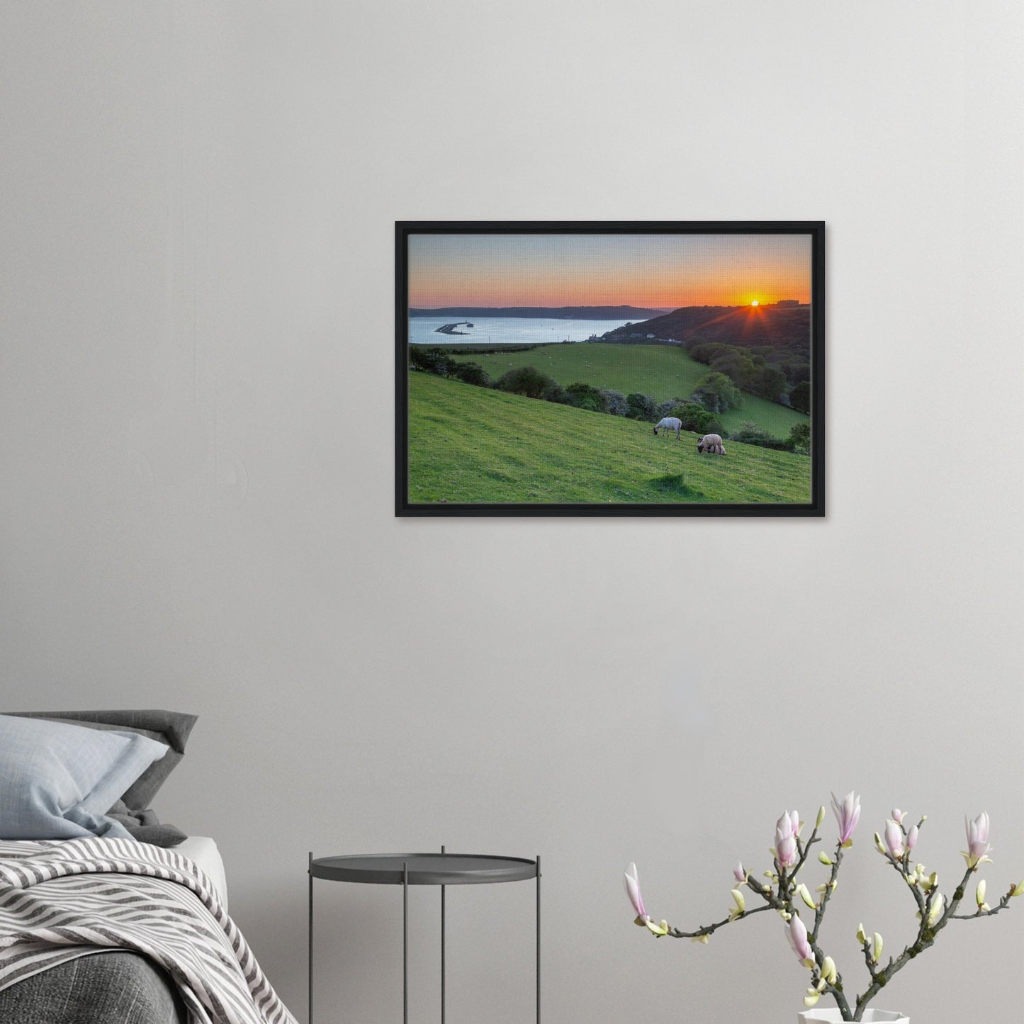 Framed print of sheep on hillside overlooking the sea