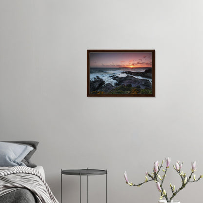 Devon sunset seascape with cliffside blooms in canvas frame