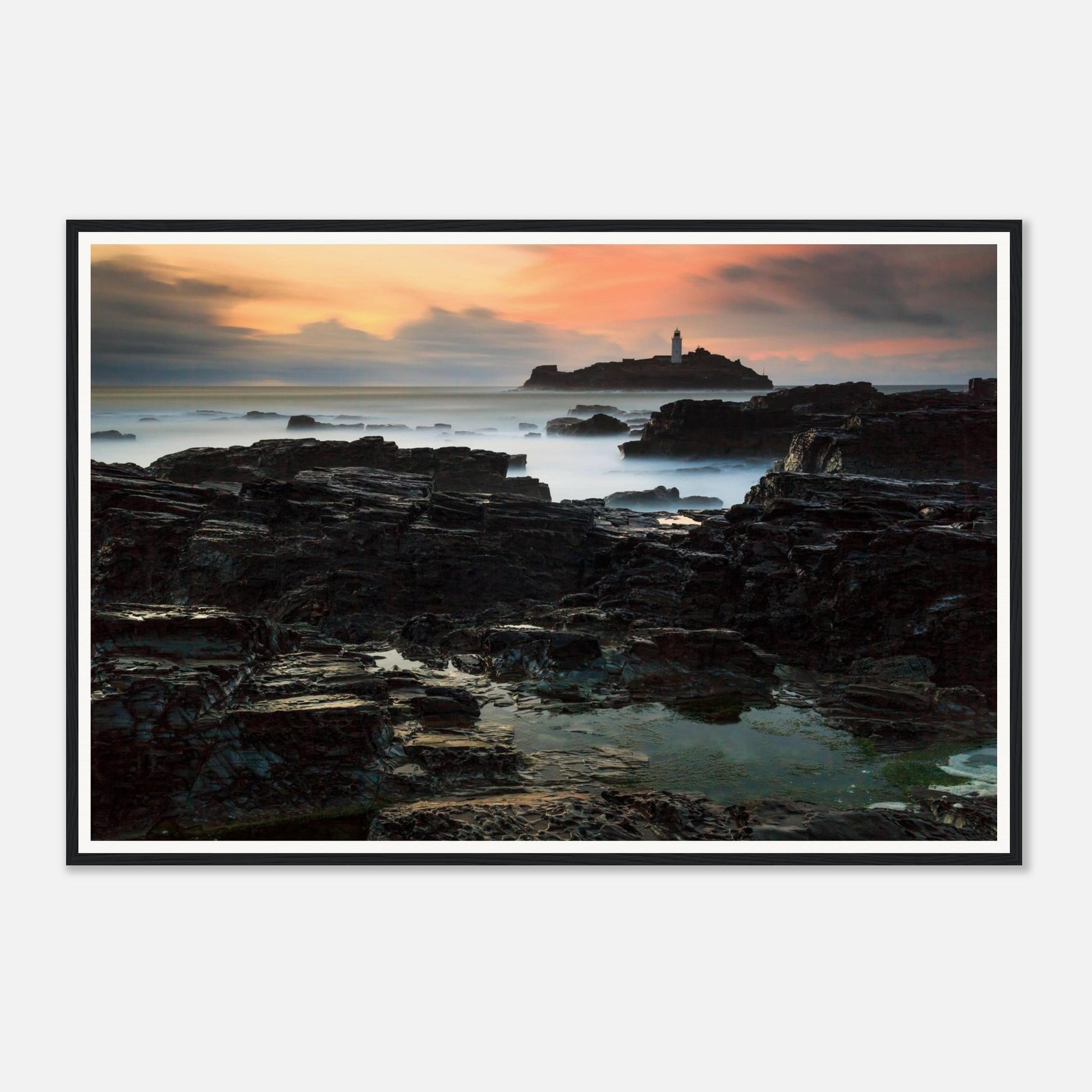 Sunset over Godrevy Lighthouse with glowing sky framed wall art