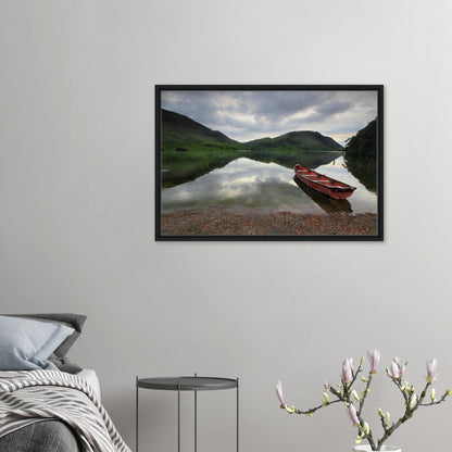 Framed canvas print of Crummock Water with red boat on shore