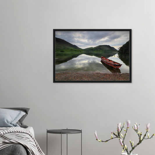 Framed canvas print of Crummock Water with red boat on shore