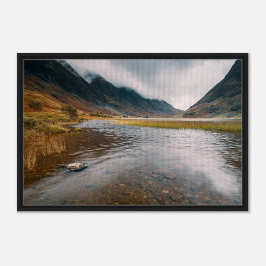 Misty mountains reflecting in Scottish loch
