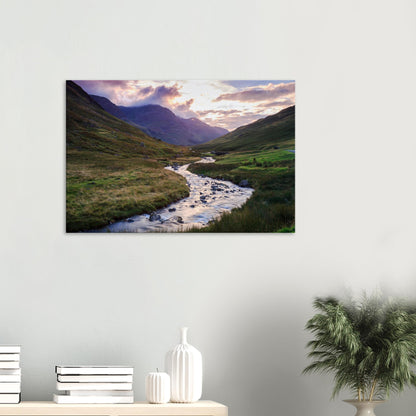 Canvas of Honister Pass capturing the gentle light of golden hour on the valley’s brook and rolling hills beneath cloudy mountains.