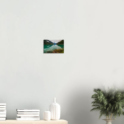 Scenic Norway lake with mossy outcrop and symmetrical reflections, canvas print.