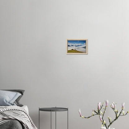 Sea of clouds beneath mountain cabin in panoramic canvas print