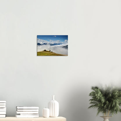 Canvas print of Resterhöhe in the Austrian Alps, featuring blue skies, mountain peaks, a sea of clouds, and a remote hilltop hut.