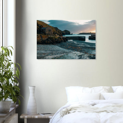 Timeless charm of Mullion Cove under a twilight sky with gentle, still waters