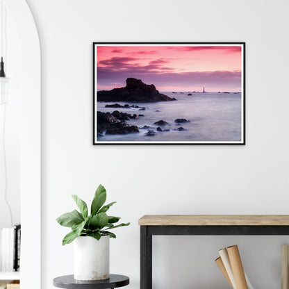 Framed art of Les Hanois Lighthouse during twilight in Guernsey