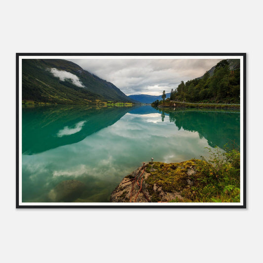 Still waters of Oldevatnet Lake mirroring overcast sky framed wall art