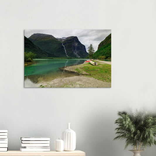 Canvas print showcasing Mount Ramnefjell towering above lush Norwegian greenery and cascading Utigardsfossen Waterfall